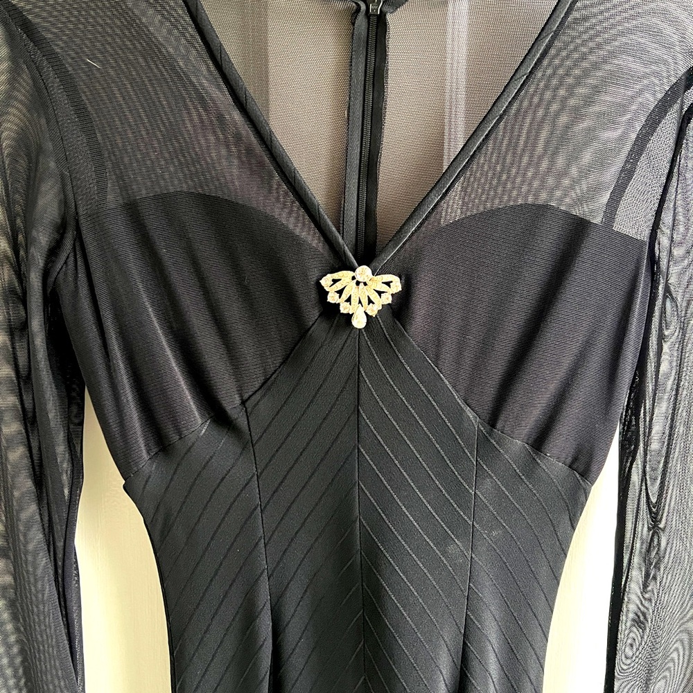 Long,J.McClintock,stretch,sheer ,cuffs accents. Gathered  base of spine.